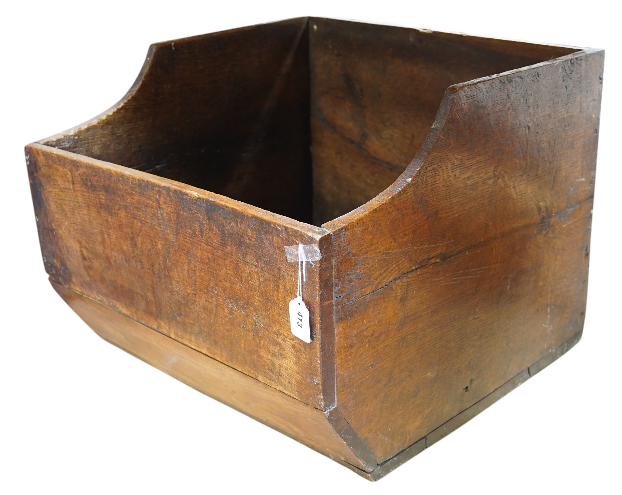 An early 20th century oak dog basket, 65cm wide. Condition - fair